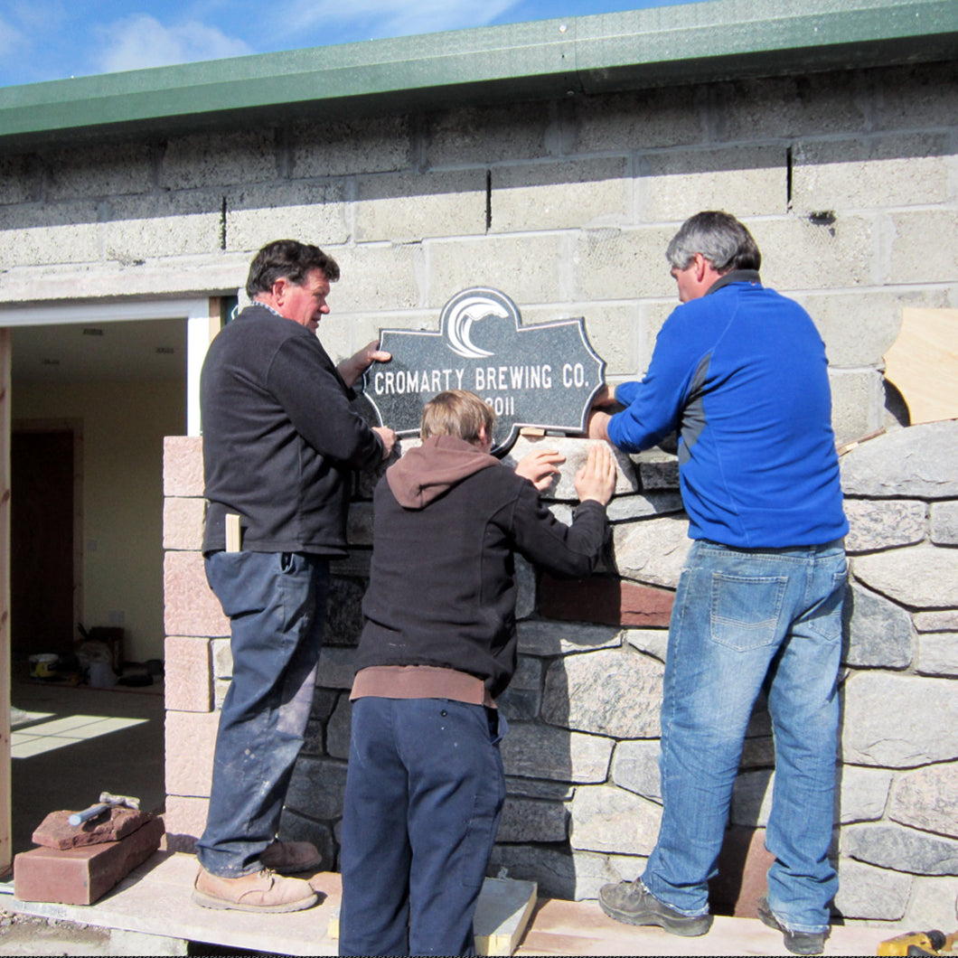 Fitting the stonework sign